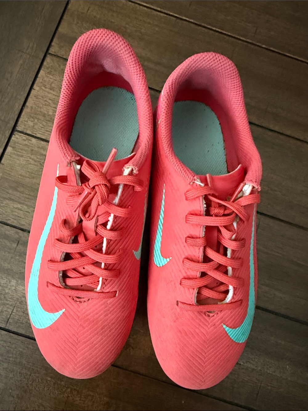 Nike Women’s Coral Pink Athletic Sneakers with Light Blue Swoosh